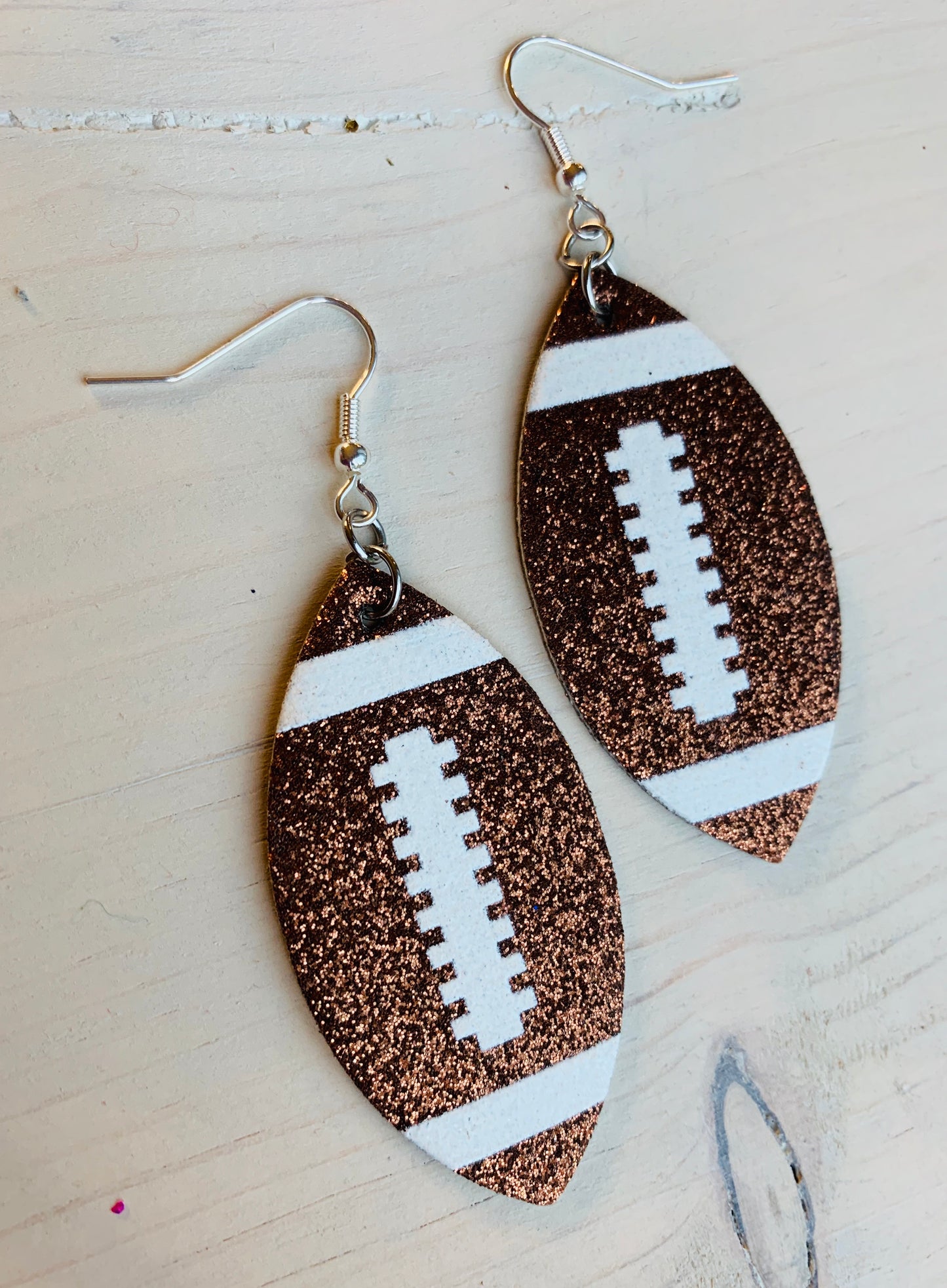 Earrings { Leather } Football. Buffalo plaid. Glitter. Basketball. Baseball. Volleyball. Paisley. Floral. Leopard. Rainbow. Giraffe. $5 jewelry! - Stacy's Pink Martini Boutique