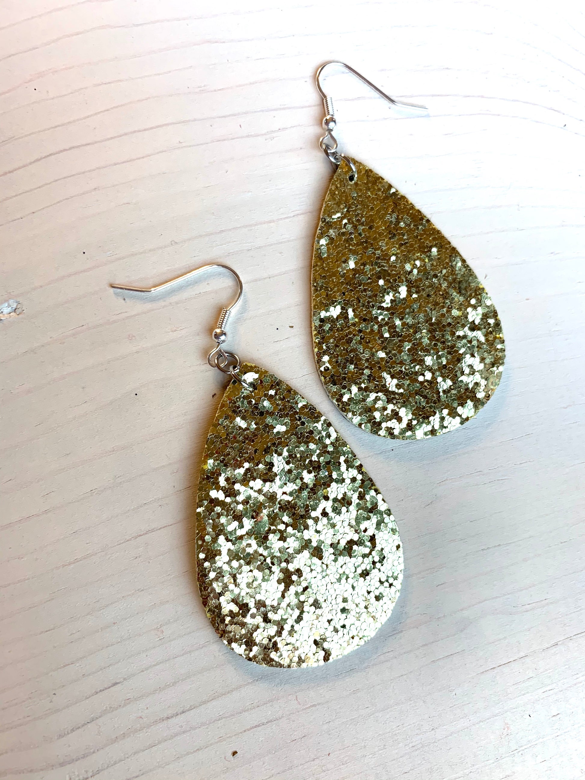 Earrings { Leather } Football. Buffalo plaid. Glitter. Basketball. Baseball. Volleyball. Paisley. Floral. Leopard. Rainbow. Giraffe. $5 jewelry! - Stacy's Pink Martini Boutique