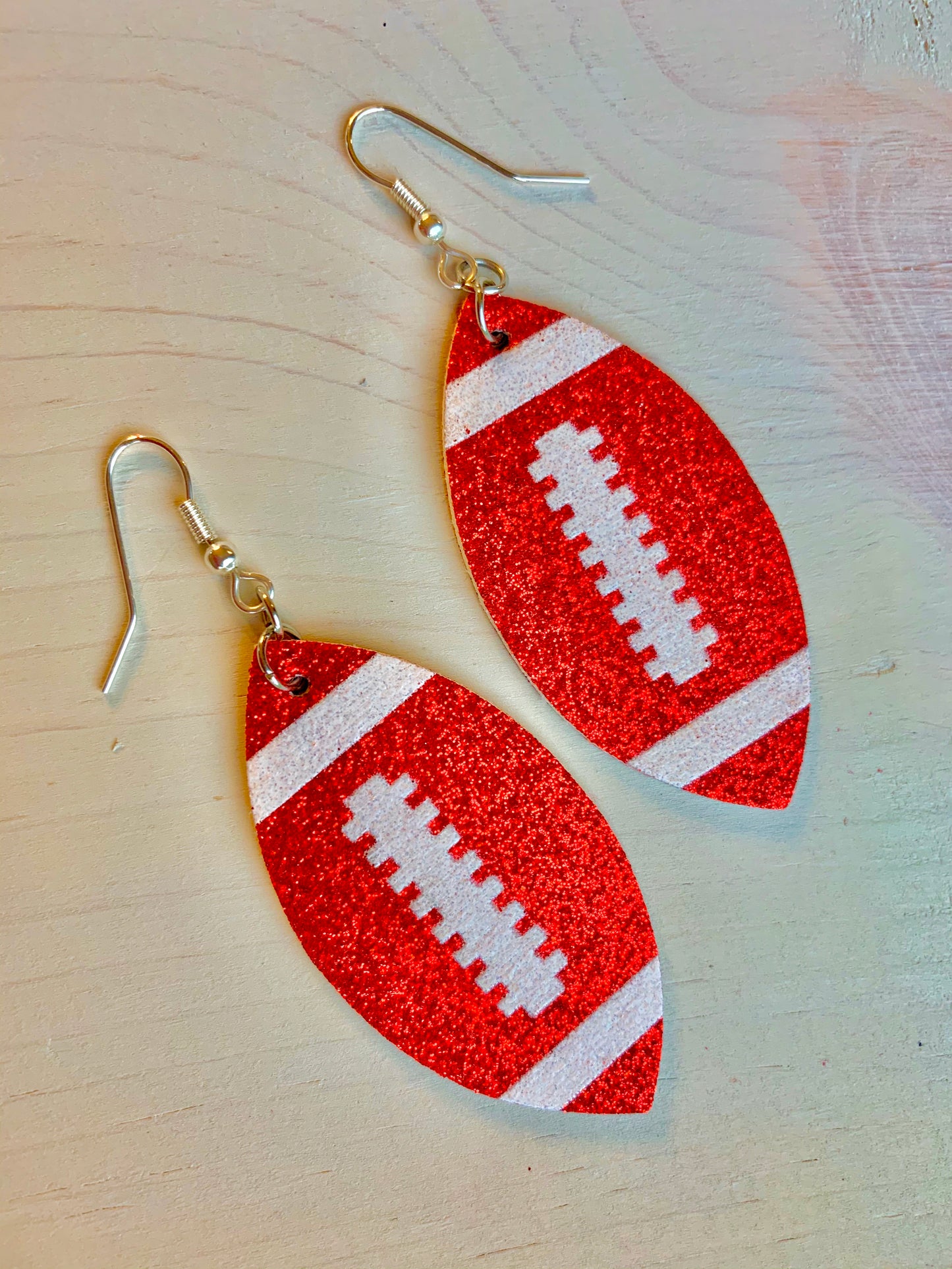 Earrings { Leather } Football. Buffalo plaid. Glitter. Basketball. Baseball. Volleyball. Paisley. Floral. Leopard. Rainbow. Giraffe. $5 jewelry! - Stacy's Pink Martini Boutique