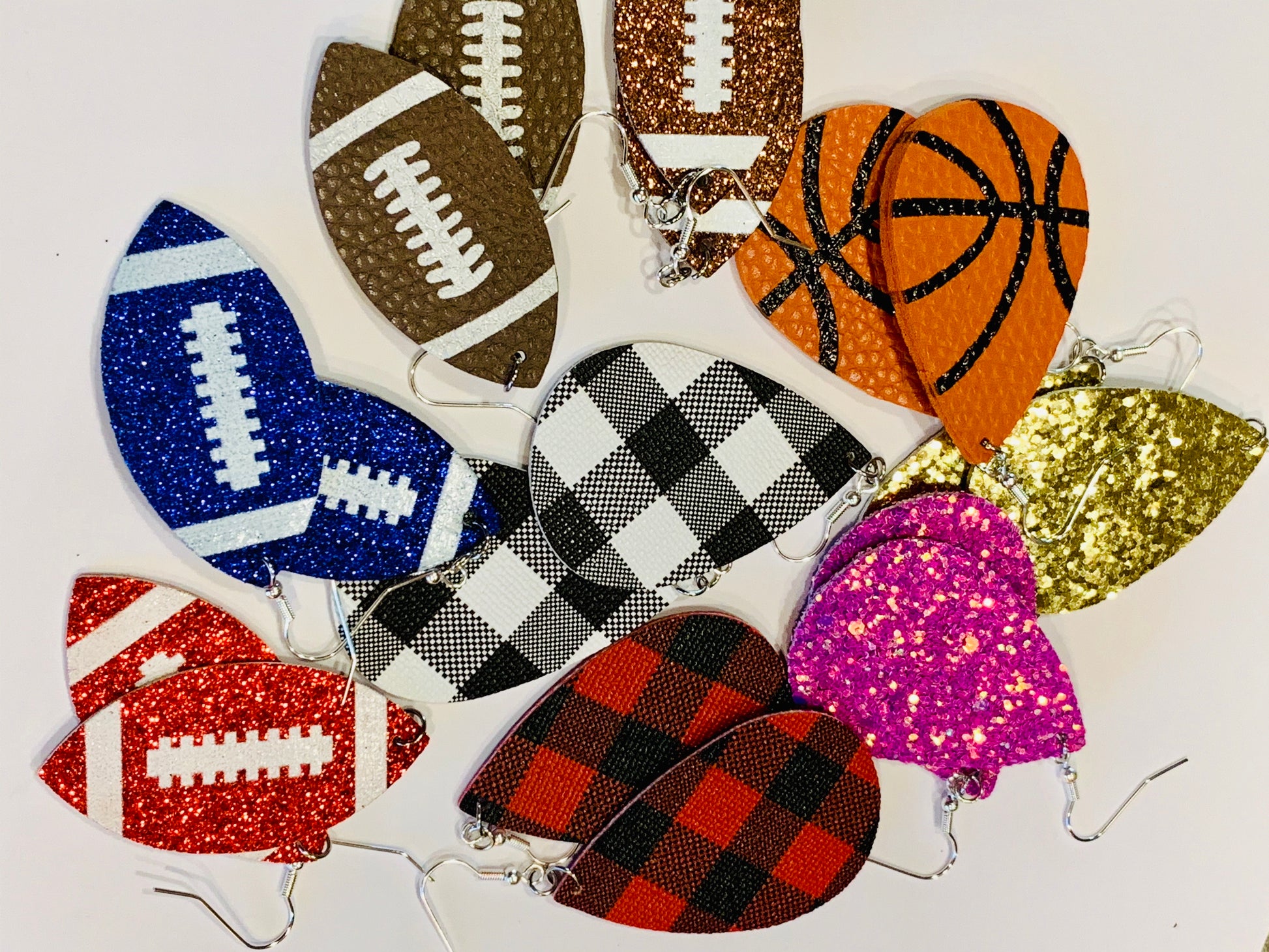Earrings { Leather } Football. Buffalo plaid. Glitter. Basketball. Baseball. Volleyball. Paisley. Floral. Leopard. Rainbow. Giraffe. $5 jewelry! - Stacy's Pink Martini Boutique