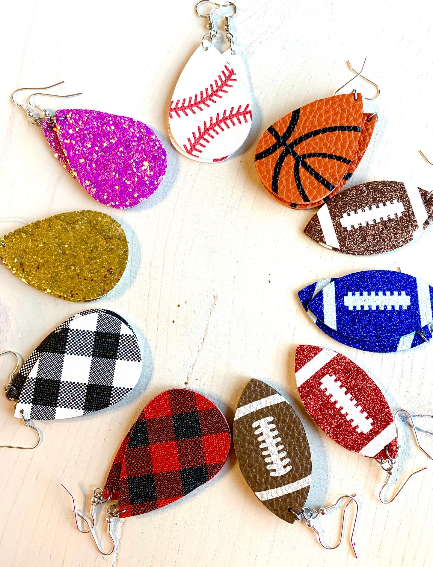 Earrings { Leather } Football. Buffalo plaid. Glitter. Basketball. Baseball. Volleyball. Paisley. Floral. Leopard. Rainbow. Giraffe. $5 jewelry! - Stacy's Pink Martini Boutique
