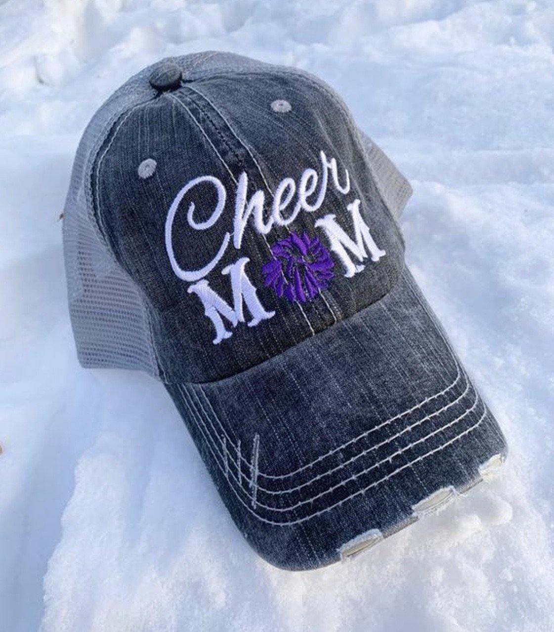 Hats { Cheer mom } Embroidered distressed trucker cap with adjustable Velcro • Pom poms • Gray with pink, teal, purple or red pom poms • Customize with names and numbers - Stacy's Pink Martini Boutique