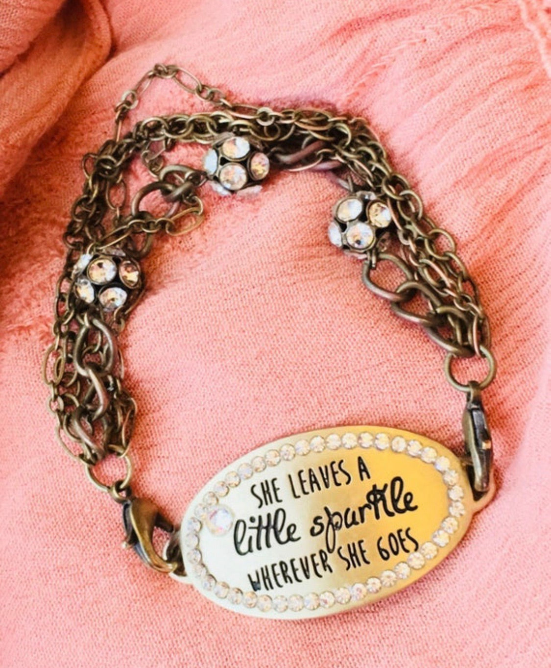 She leaves a little sparkle wherever she goes. Bracelet. Leather wrap or gold chain. Charms. - Stacy's Pink Martini Boutique