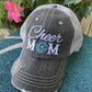 Hats { Cheer mom } Embroidered distressed trucker cap with adjustable Velcro • Pom poms • Gray with pink, teal, purple or red pom poms • Customize with names and numbers - Stacy's Pink Martini Boutique