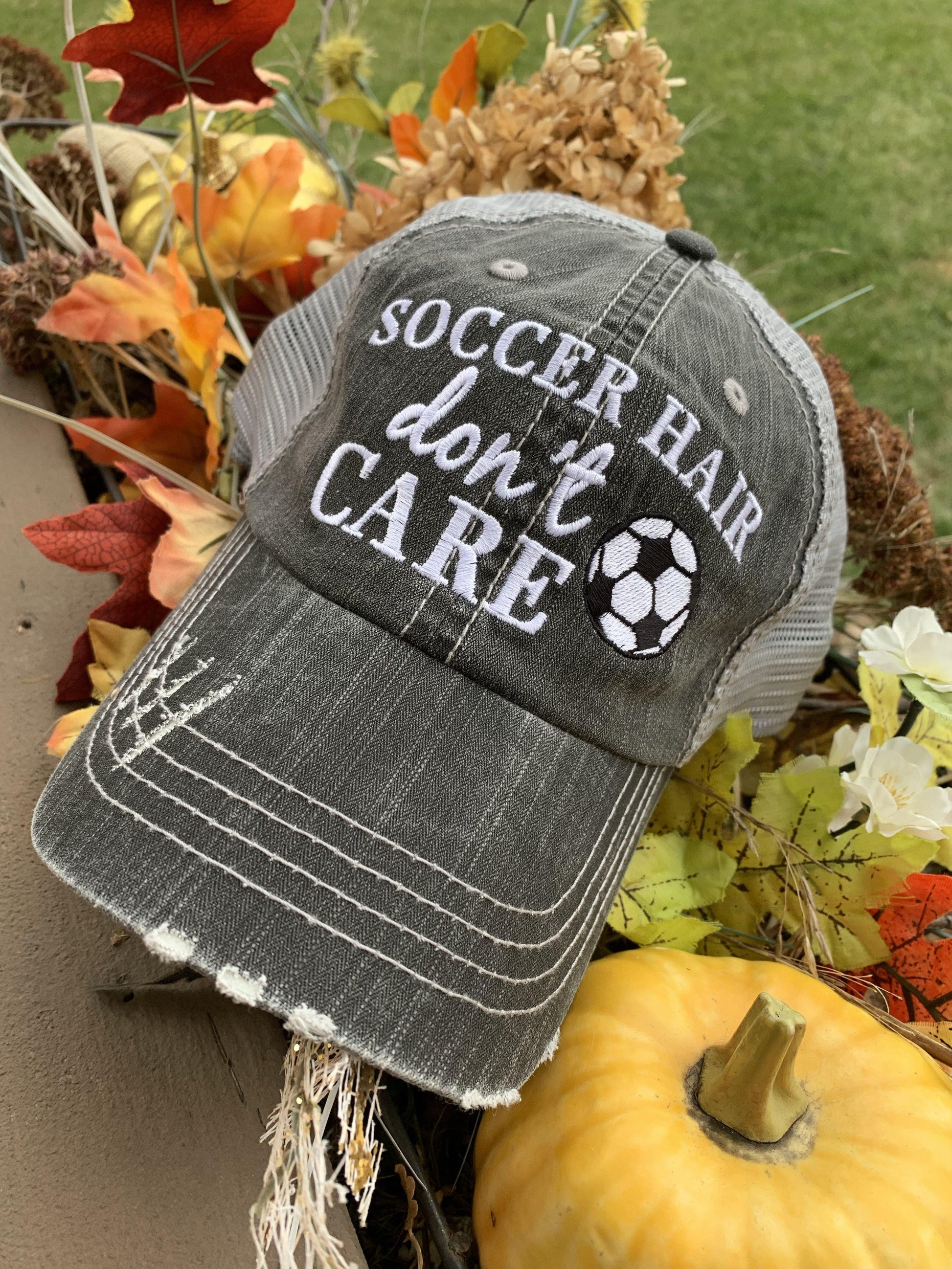 Hats { Soccer hair don’t care } Gray embroidered distressed trucker cap with adjustable Velcro and hole for pony. Soccer ball. Soccer mom. - Stacy's Pink Martini Boutique
