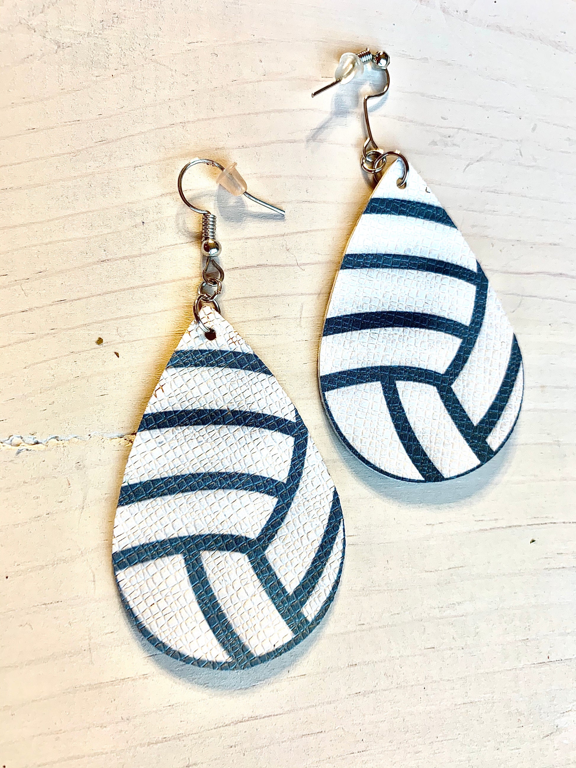 Earrings { Leather } Football. Buffalo plaid. Glitter. Basketball. Baseball. Volleyball. Paisley. Floral. Leopard. Rainbow. Giraffe. $5 jewelry! - Stacy's Pink Martini Boutique